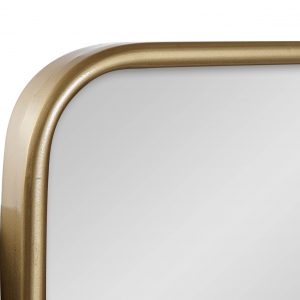 ¡Añade un toque de lujo a tu hogar con un espejo de metal dorado! Esta pieza decorativa única se destaca por su moderno diseño con detalles dorados